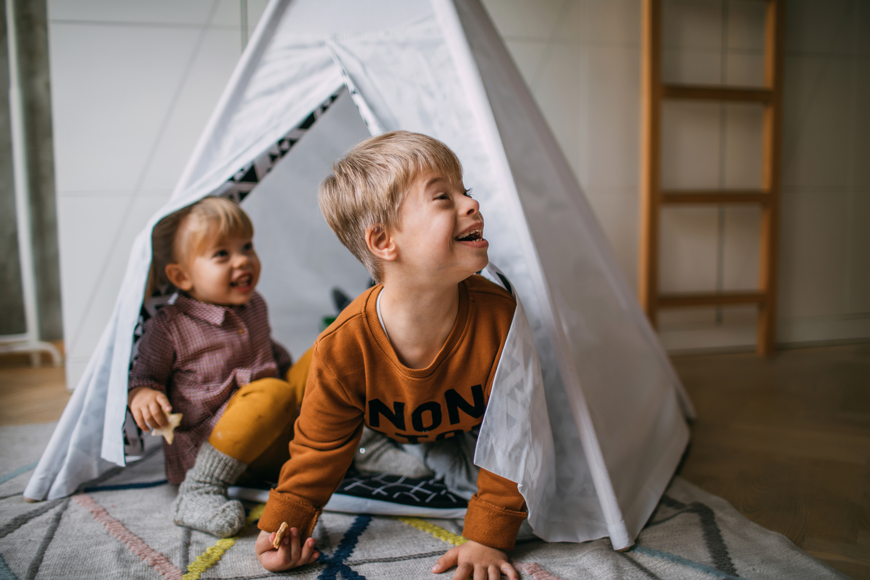Children playing in an in-door tent.